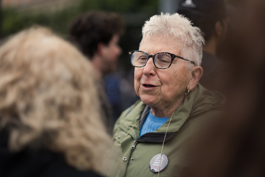 elderly woman smiling at event