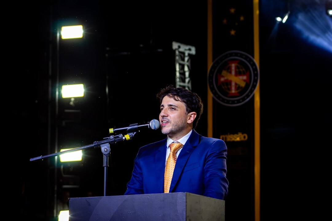 politician speaking at podium