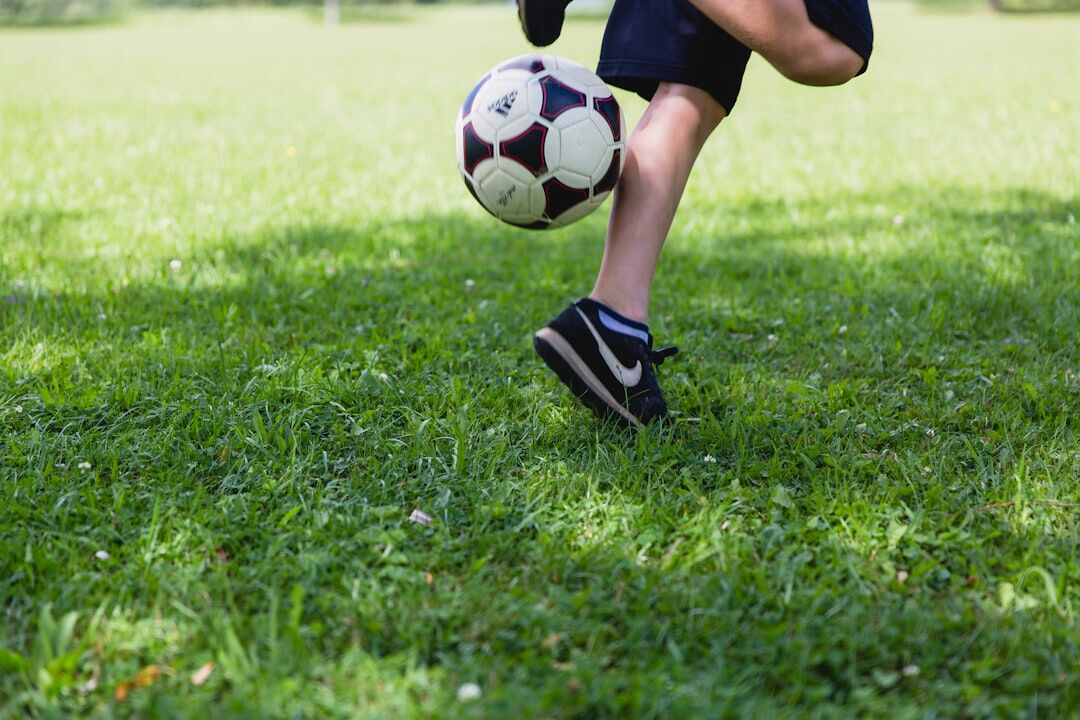 young footballer practicing